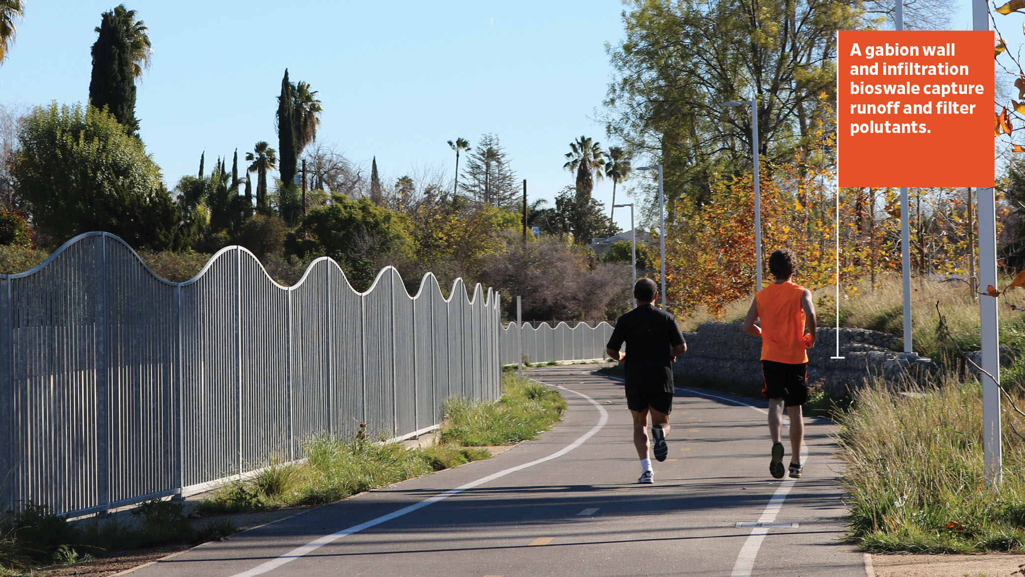 As runners jog by on the LA Riverfront Greenway, a gabion retaining wall and infiltration bioswale capture runoff and filter pollutants.