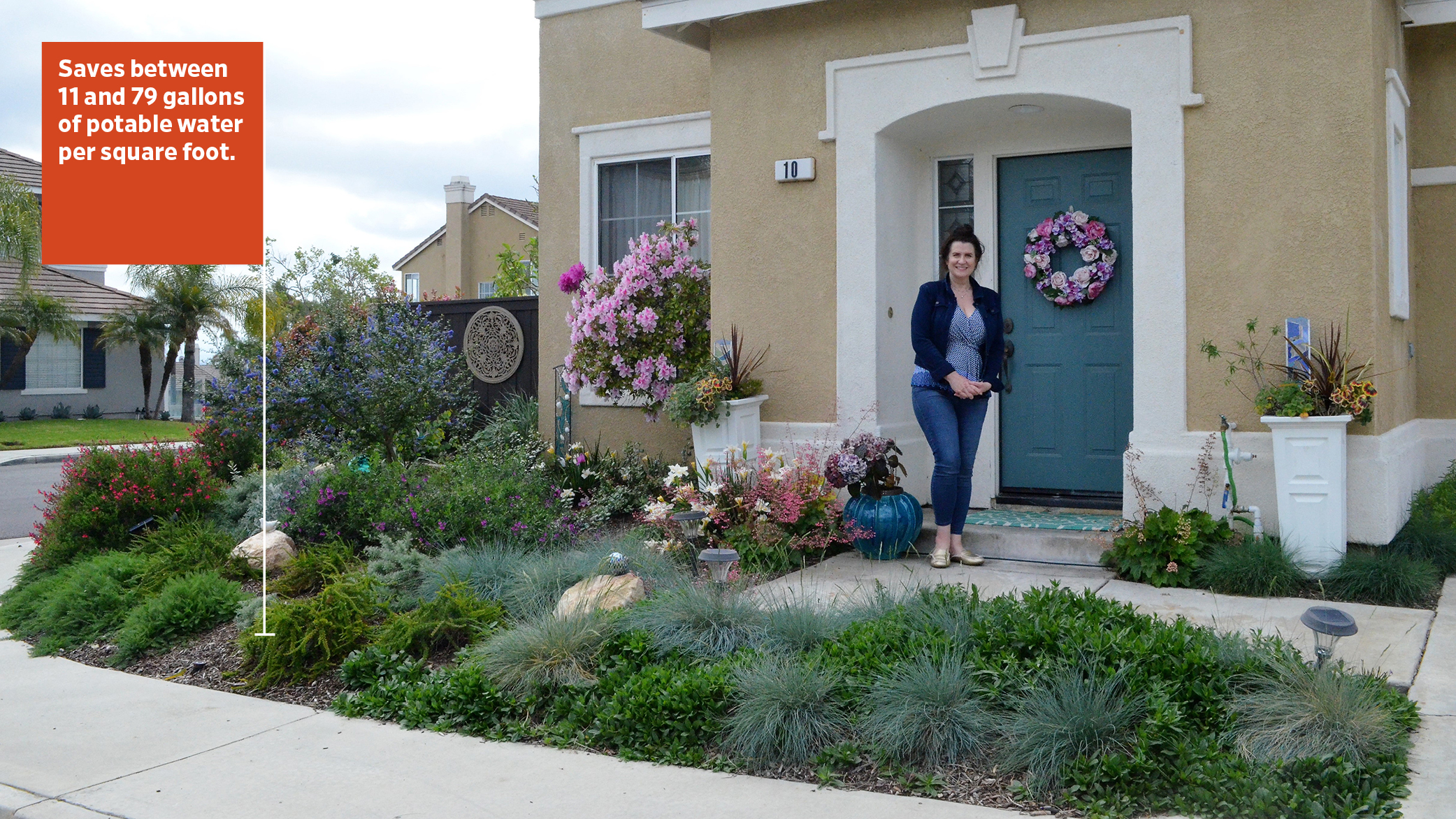 A homeowner stands in front of her NatureScape gardens in Orange County, California. There are diverse and appealing native plants.